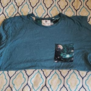 On the byas 1 pocket green shirt.      Size XL
